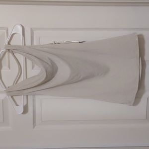 Cream colored sleeveless sparkly cowl neck top